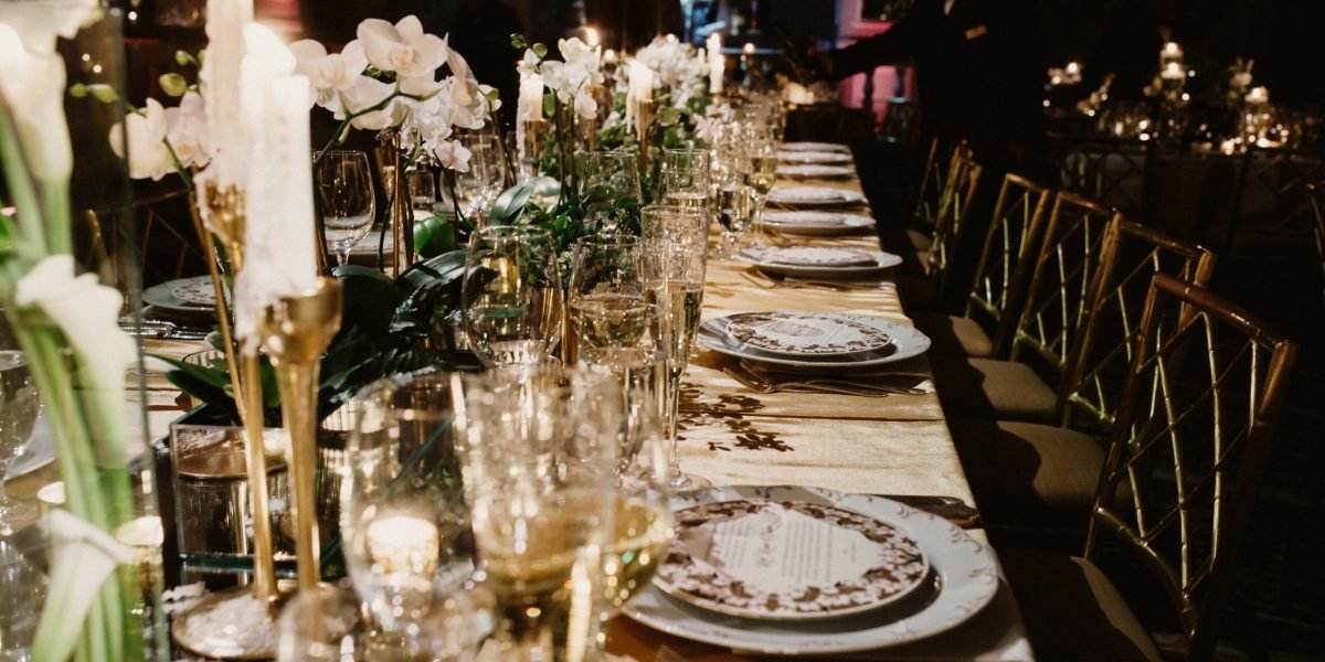 The festive table at the restaurant is decorated with candles and flowers