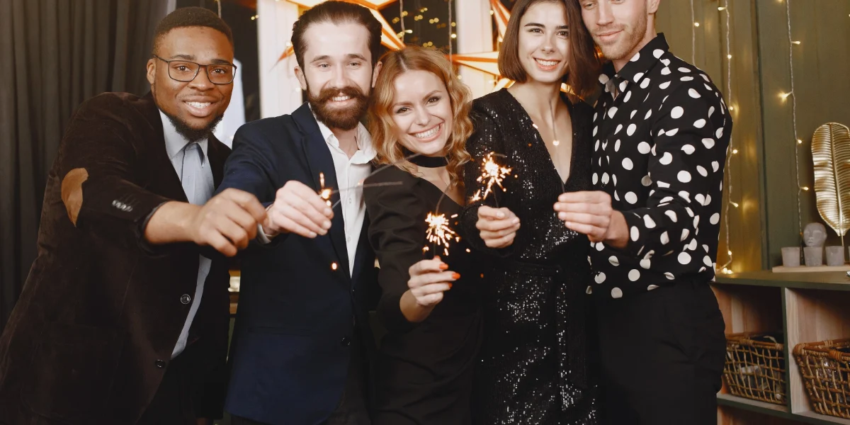 people christman decorations man black suit group celebrations new year people with bengal lights